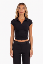 Black polo-collar ruched crop top — collar and side ruching detail